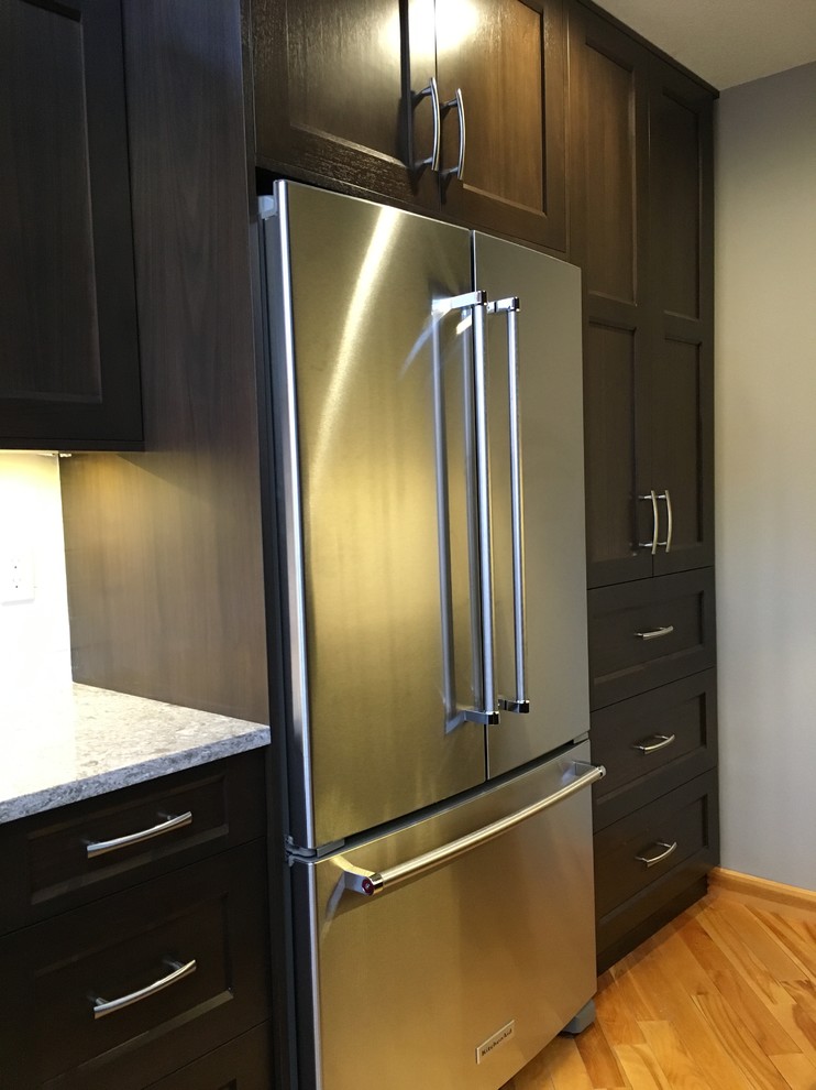 Example of a transitional kitchen design in Calgary