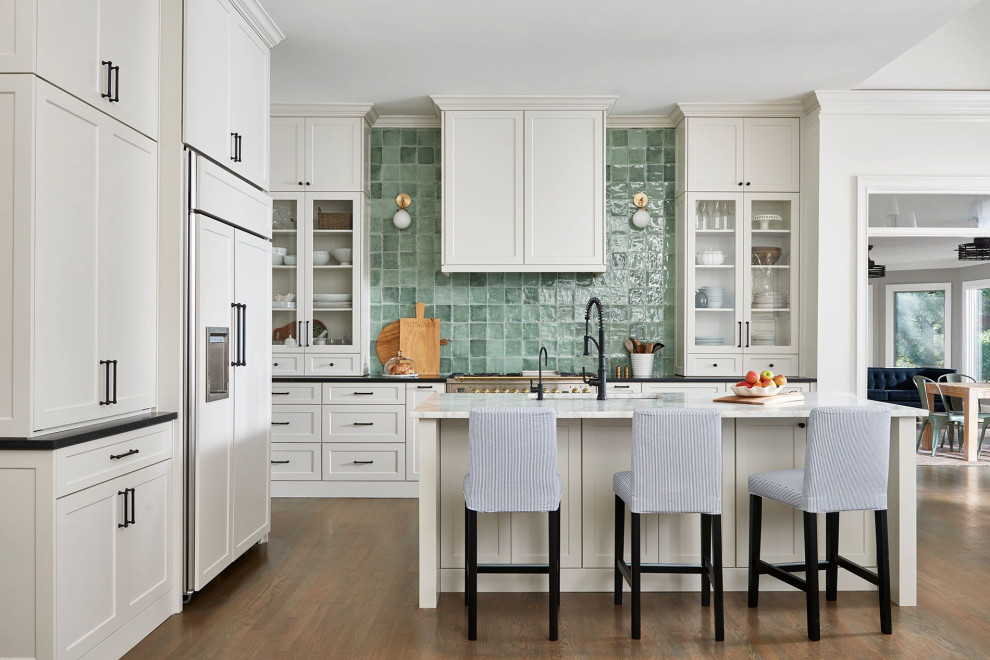 Inspiration for a transitional kitchen in Atlanta with shaker cabinets, marble benchtops, green splashback, ceramic splashback and with island.