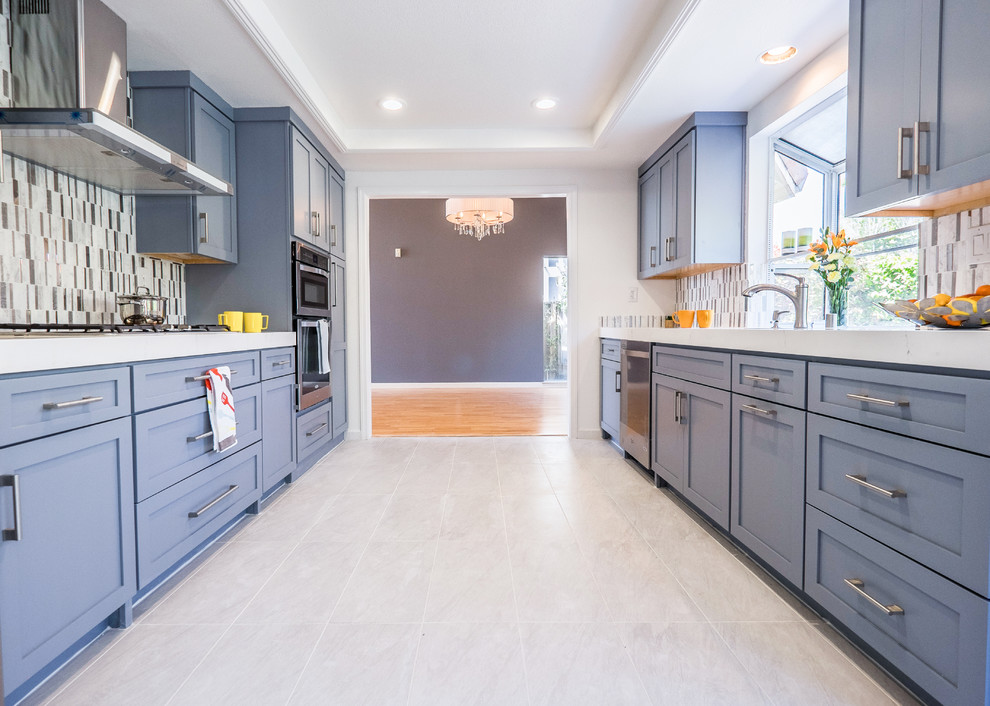 Inspiration for a mid-sized transitional galley separate kitchen in San Francisco with an undermount sink, shaker cabinets, grey cabinets, quartzite benchtops, multi-coloured splashback, ceramic splashback, stainless steel appliances, ceramic floors, no island and grey floor.