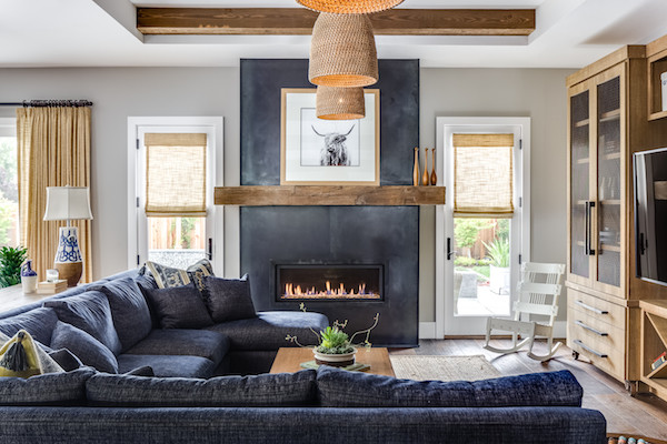 Design ideas for a large country open concept family room in San Francisco with grey walls, dark hardwood floors, a ribbon fireplace, a plaster fireplace surround and a built-in media wall.