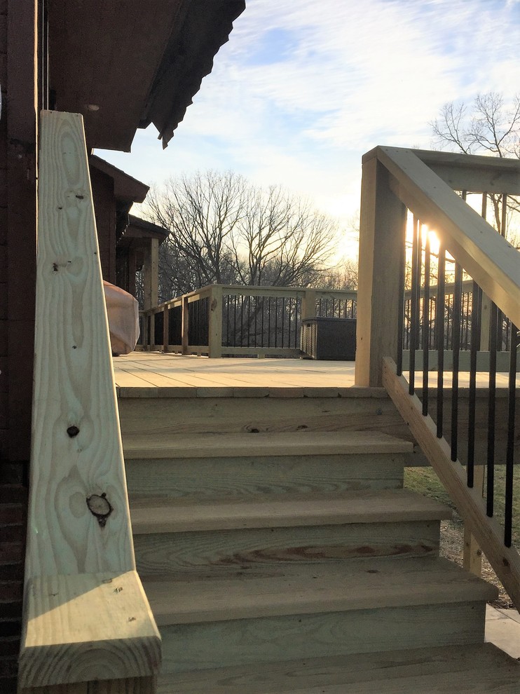 Example of a huge backyard deck design with no cover