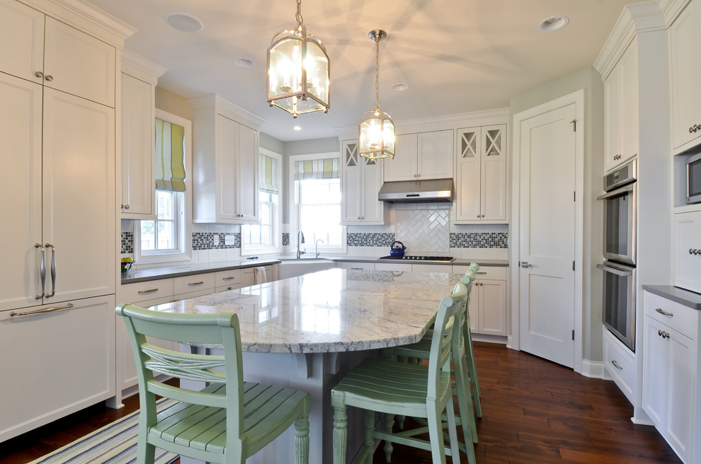 Inspiration for a traditional eat-in kitchen in Minneapolis with white cabinets.
