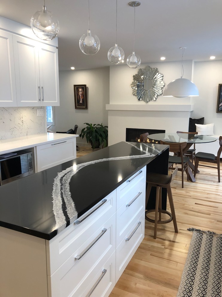 Example of a transitional kitchen design in Montreal