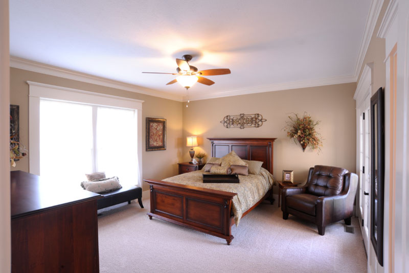Design ideas for a country master bedroom with beige walls, carpet and beige floor.