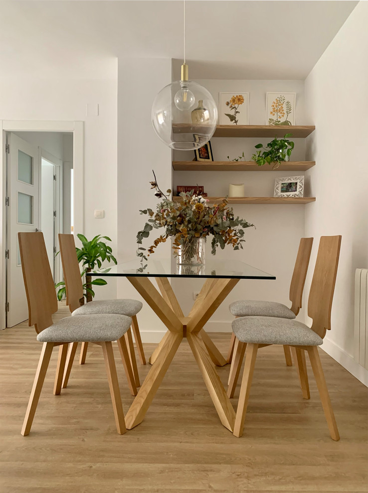 Example of a danish medium tone wood floor and beige floor great room design in Other with white walls