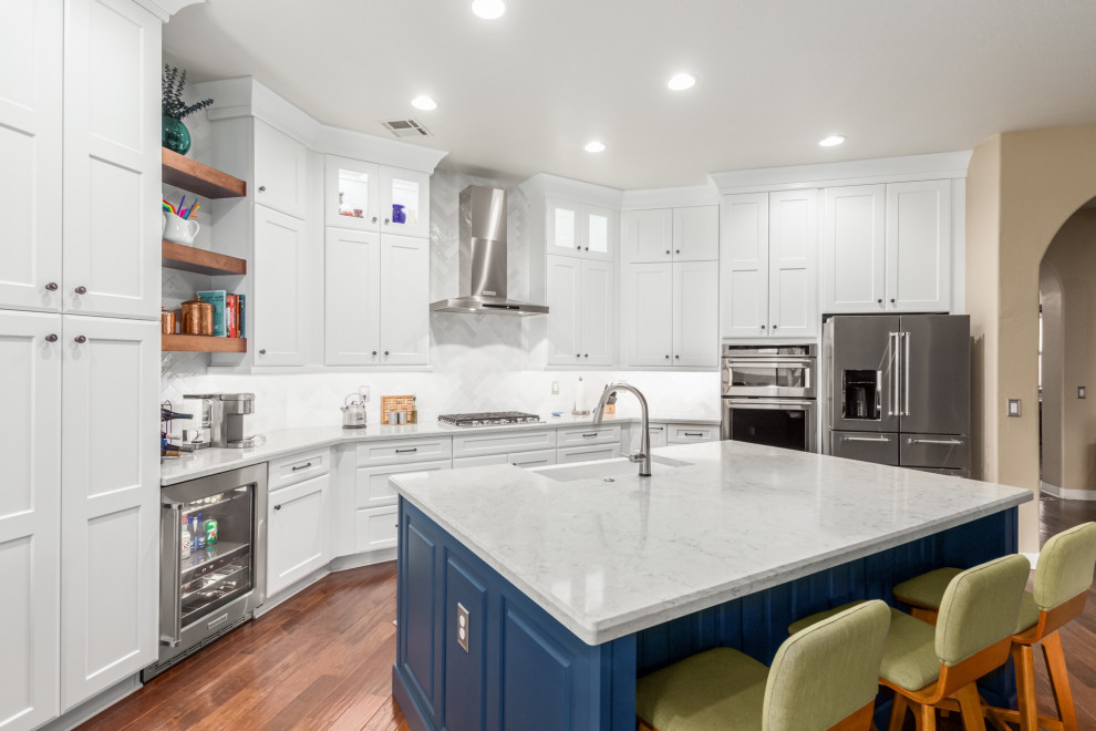 Inspiration for a transitional kitchen remodel in Phoenix with a farmhouse sink, shaker cabinets, white cabinets, white backsplash, subway tile backsplash and white countertops