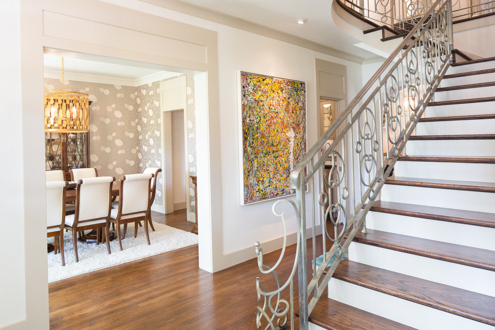 Photo of a transitional wood l-shaped staircase in Dallas with painted wood risers.