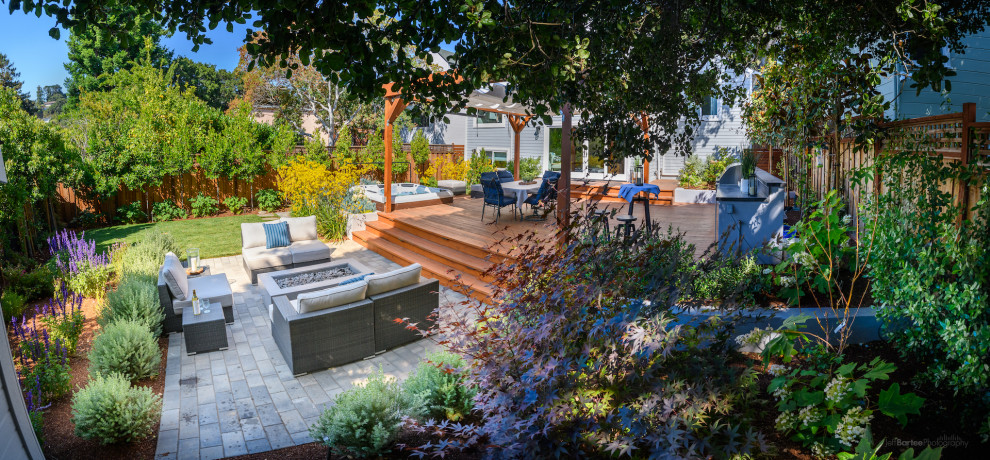 Photo of a mid-sized transitional backyard garden in San Francisco with a fire feature.