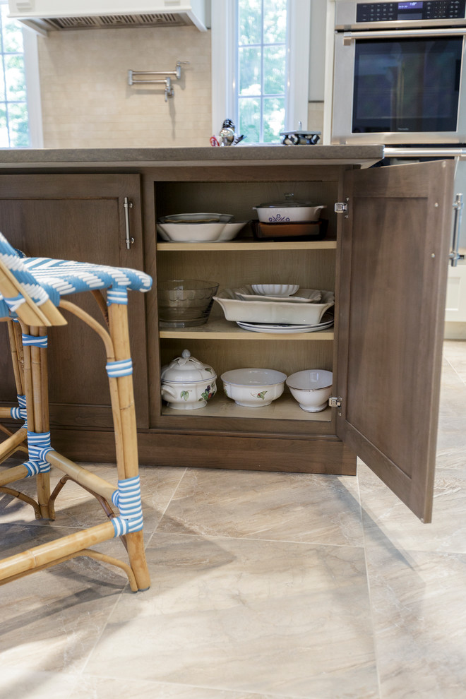 Inspiration for a mid-sized rustic l-shaped porcelain tile and beige floor open concept kitchen remodel in Bridgeport with an undermount sink, shaker cabinets, white cabinets, granite countertops, beige backsplash, porcelain backsplash, stainless steel appliances and an island