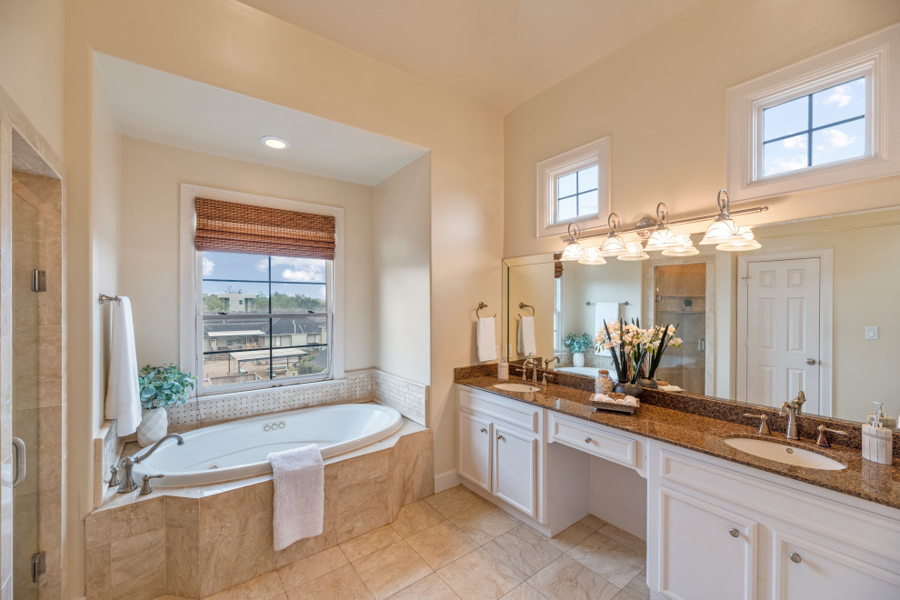 Design ideas for a large traditional master bathroom in Houston with an alcove tub, an alcove shower, beige walls, slate floors, granite benchtops, beige floor, a hinged shower door, brown benchtops, a niche, a double vanity and a built-in vanity.