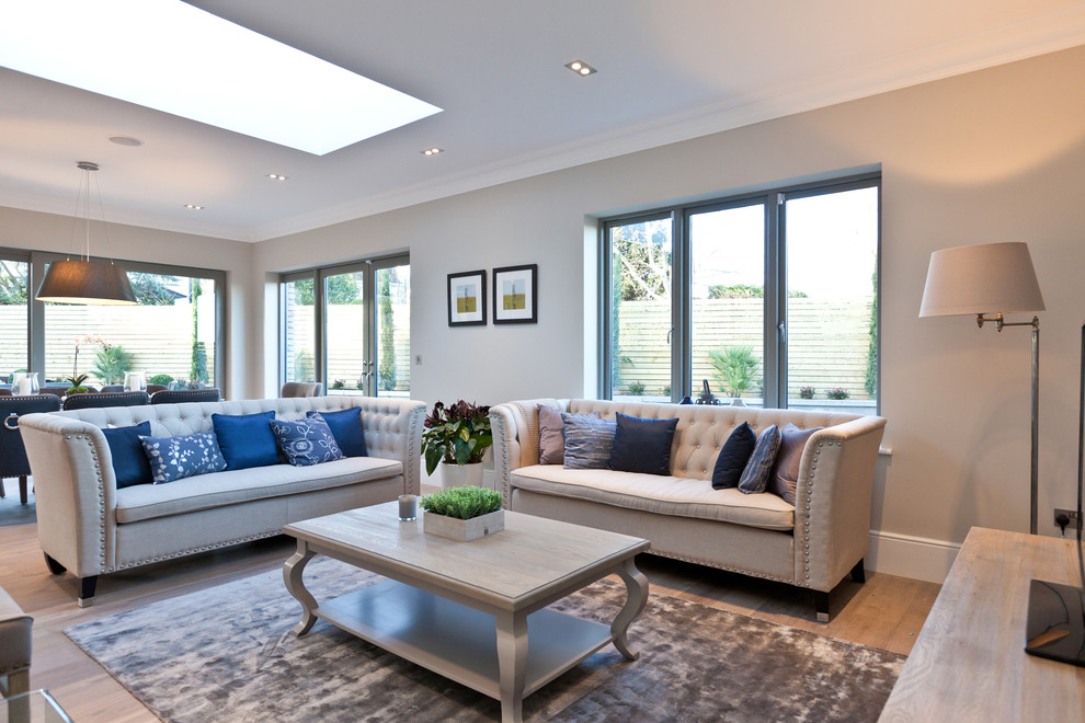 Photo of a mid-sized transitional formal open concept living room in Dublin with beige walls.