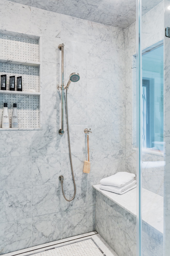 This is an example of a mid-sized traditional master bathroom in Boston with white tile, stone tile, grey walls, marble floors, an alcove shower, a one-piece toilet, an undermount sink, an open shower, a niche and a shower seat.