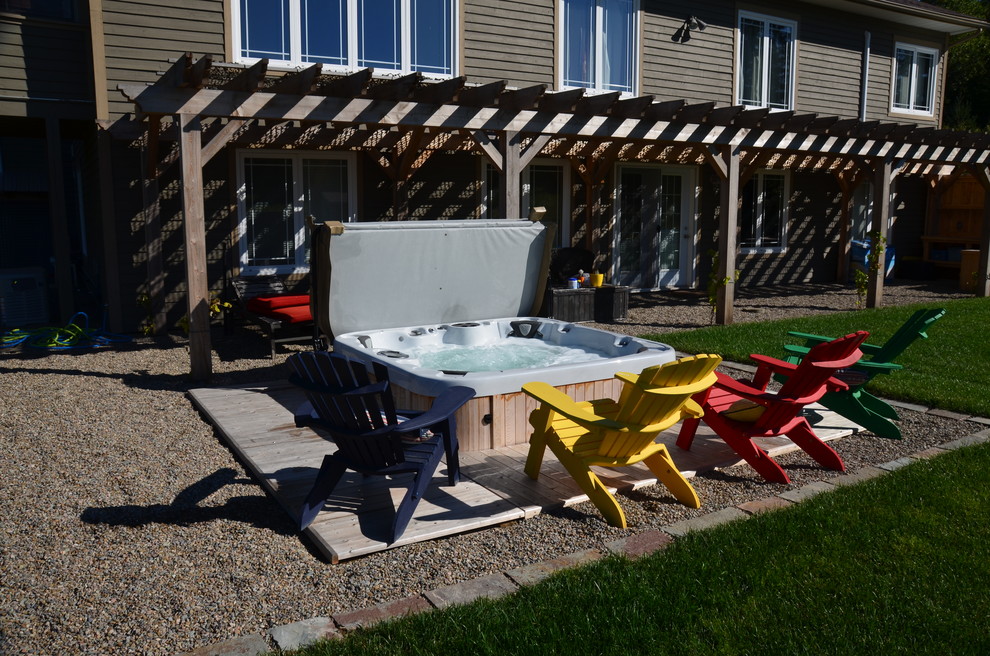 Large mountain style backyard stamped concrete and rectangular pool photo