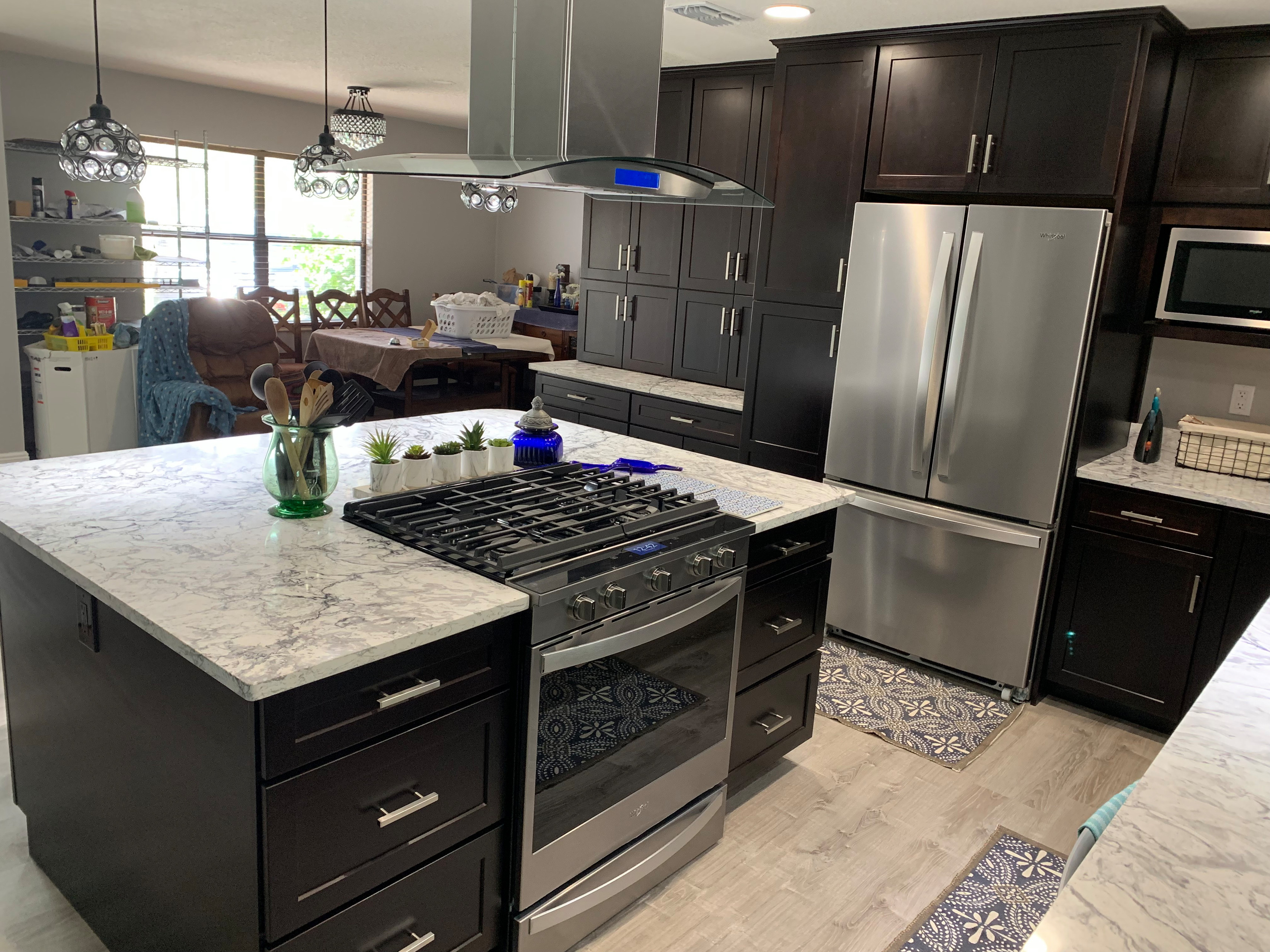 This was a pretty major kitchen remodel under taken by the home owner.  He removed several walls and incorporated a former family room into an expanded kitchen with an island.  The impact of this chan