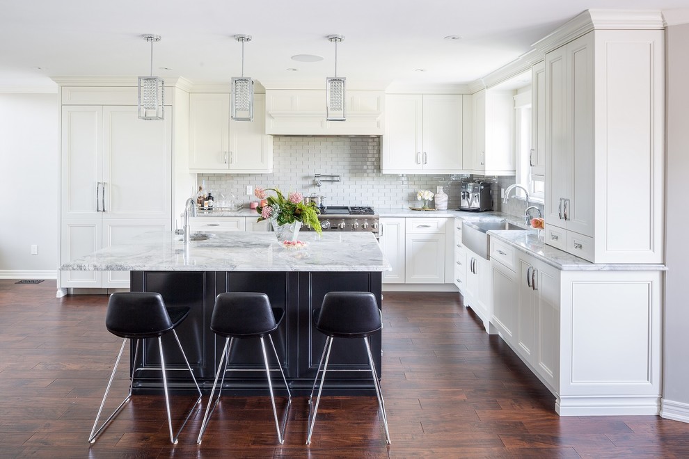 Kitchen - large transitional l-shaped dark wood floor and brown floor kitchen idea in Toronto with a farmhouse sink, shaker cabinets, gray backsplash, ceramic backsplash, stainless steel appliances, an island and white countertops