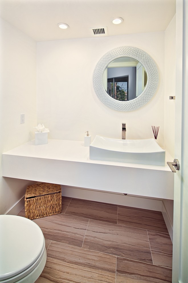 This is an example of a small contemporary powder room in Phoenix.