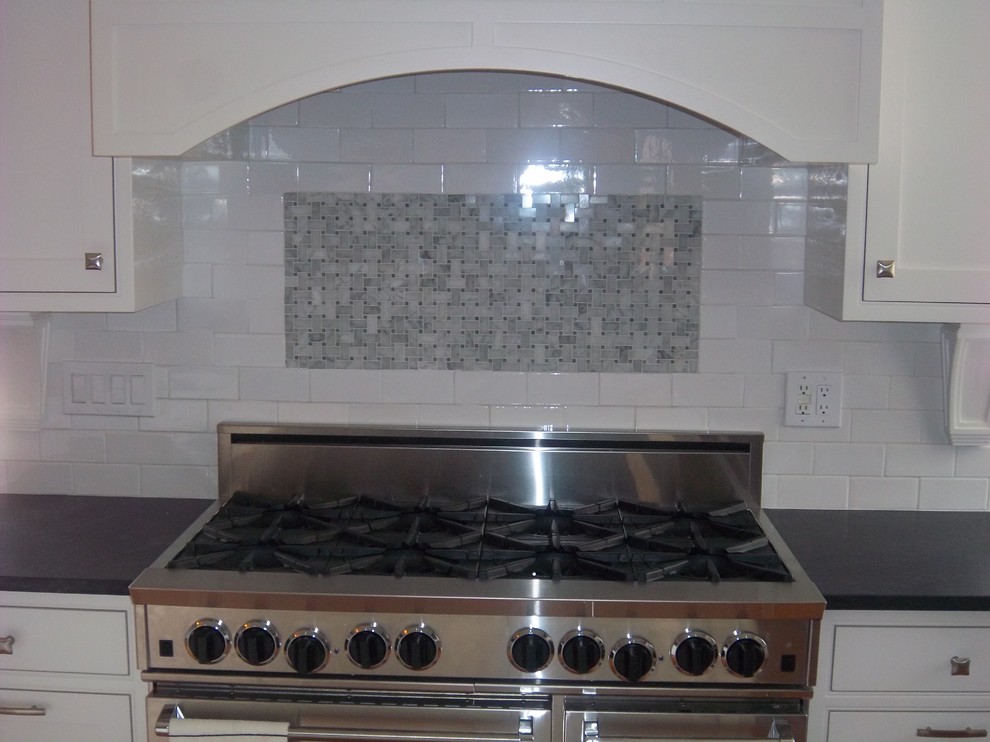 Example of a transitional kitchen design in New York