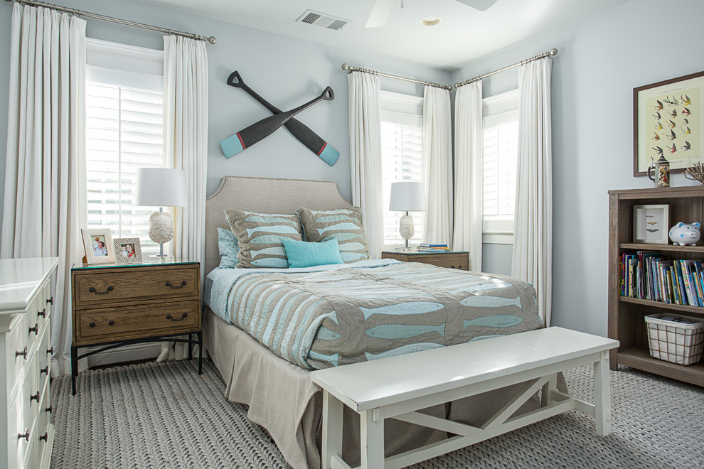 Beach style gender-neutral kids' bedroom in Dallas with grey walls.