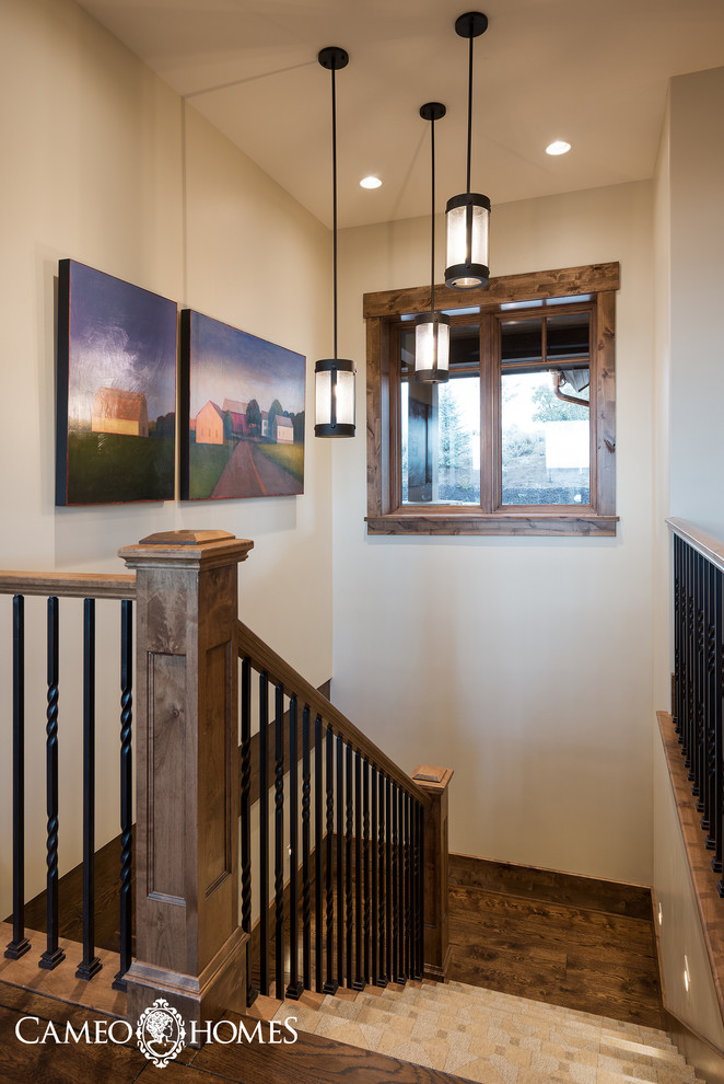Design ideas for a mid-sized country tile u-shaped staircase in Salt Lake City.
