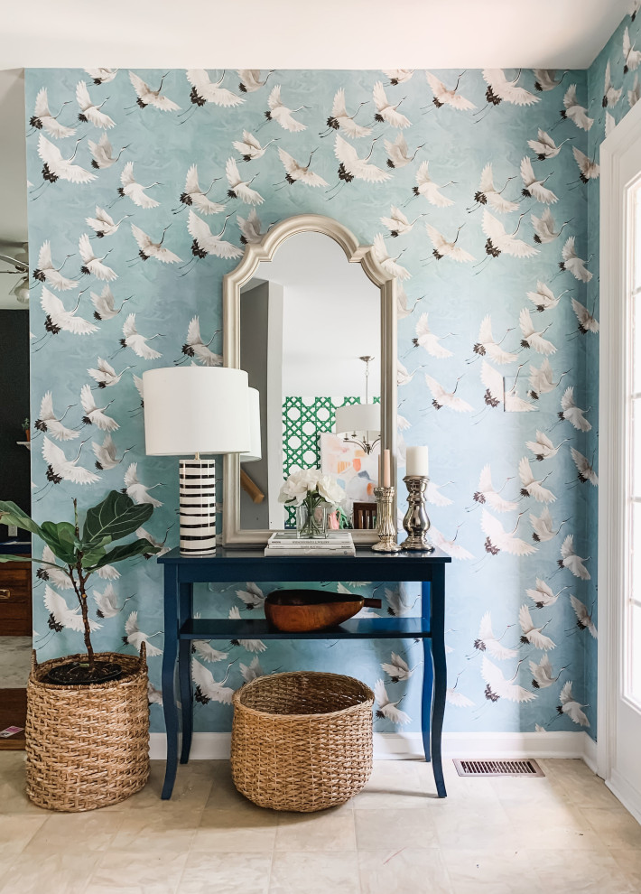 Photo of a small beach style foyer in Other with blue walls, a blue front door and wallpaper.