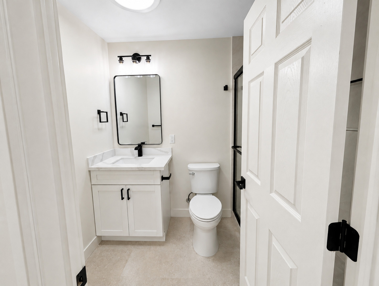 Professional garage conversion ADU featuring a fully converted one-bedroom living space with a full bathroom, full kitchen, in-unit washer and dryer, and private residential layout. This type of garag