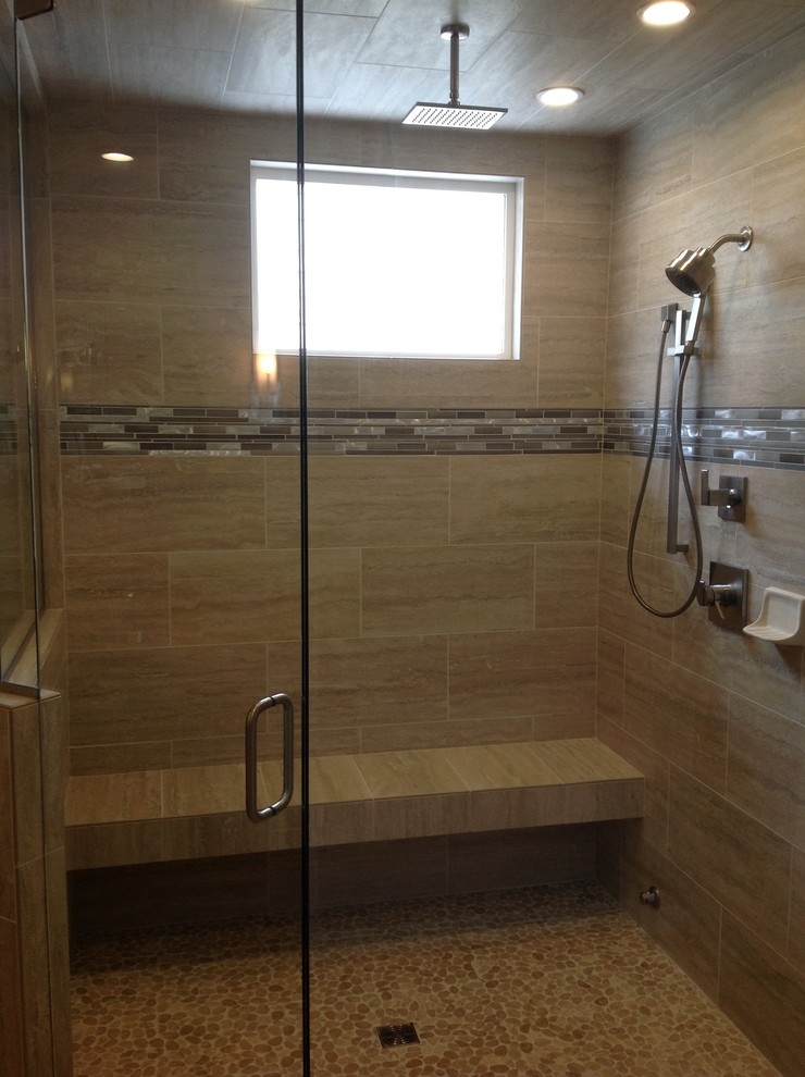 Example of a mid-sized transitional 3/4 porcelain tile corner shower design in Denver with shaker cabinets, dark wood cabinets, beige walls, an undermount sink and solid surface countertops