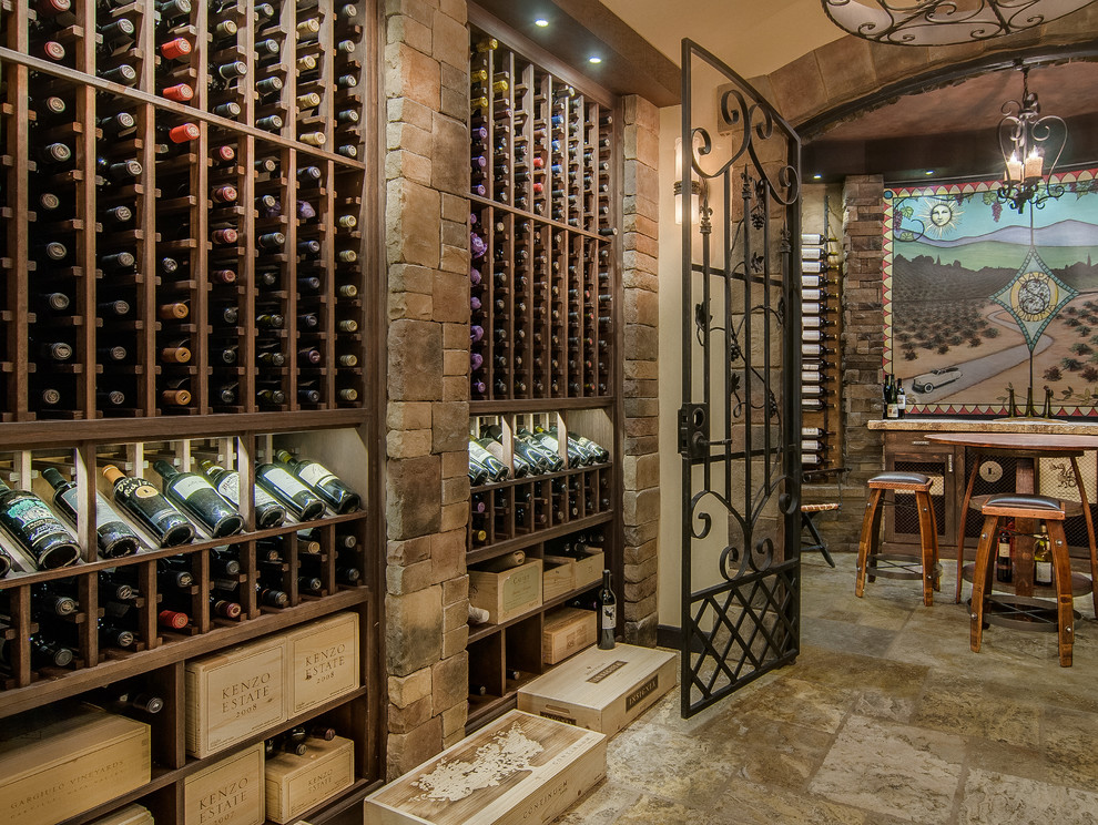 Design ideas for a mid-sized country wine cellar in Nashville with ceramic floors, storage racks and beige floor.