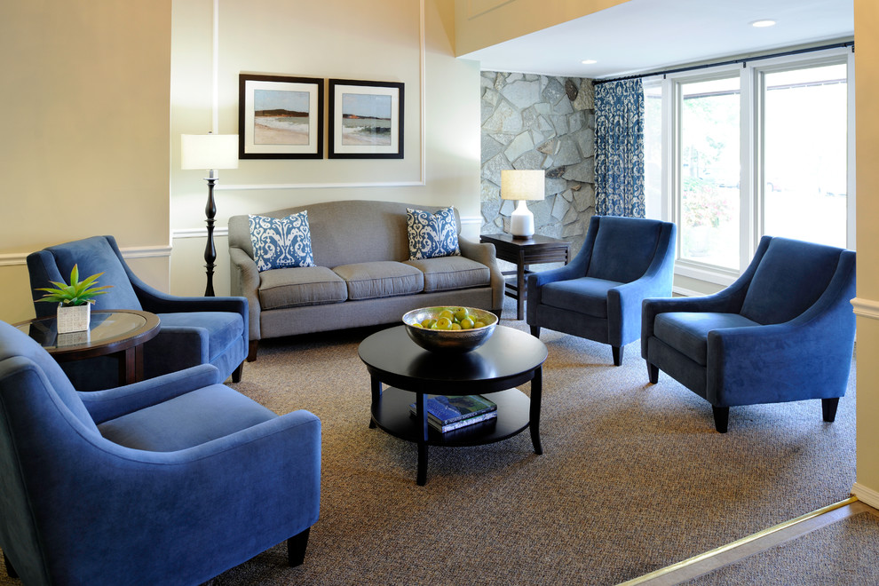 Inspiration for a mid-sized transitional enclosed living room in St Louis with beige walls and carpet.