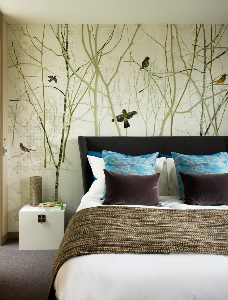 Inspiration for a contemporary guest bedroom in London with carpet, no fireplace and multi-coloured walls.
