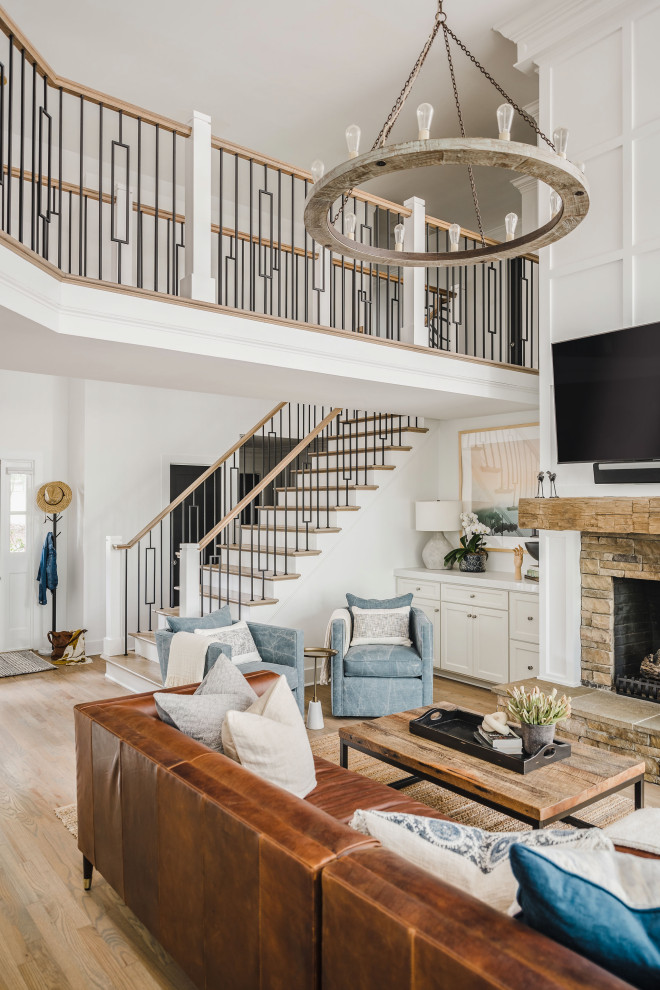 This is an example of a mid-sized beach style wood straight staircase in Charlotte with painted wood risers and mixed railing.