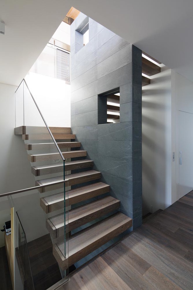 Design ideas for a mid-sized contemporary wood straight staircase in Sydney with open risers.