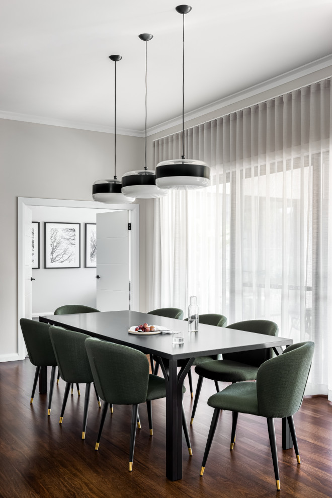 This is an example of a large contemporary dining room in Sydney with dark hardwood floors.