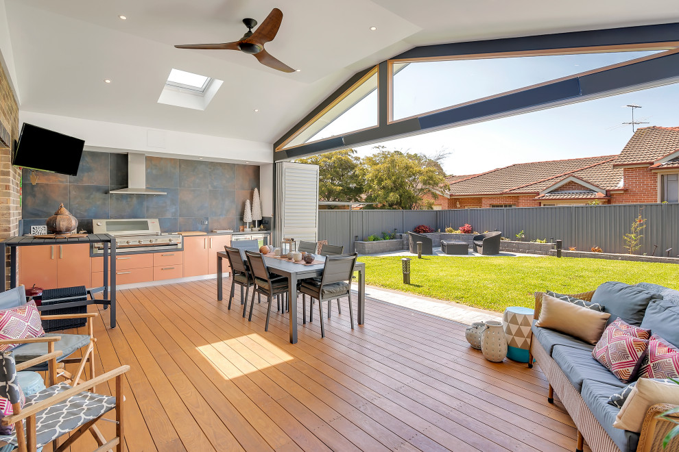 Design ideas for a mid-sized contemporary sunroom in Sydney with dark hardwood floors, a skylight and brown floor.