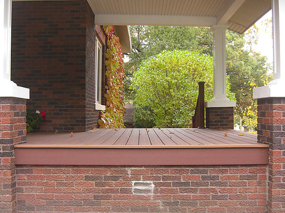 Mid-sized balcony deck photo with a roof extension