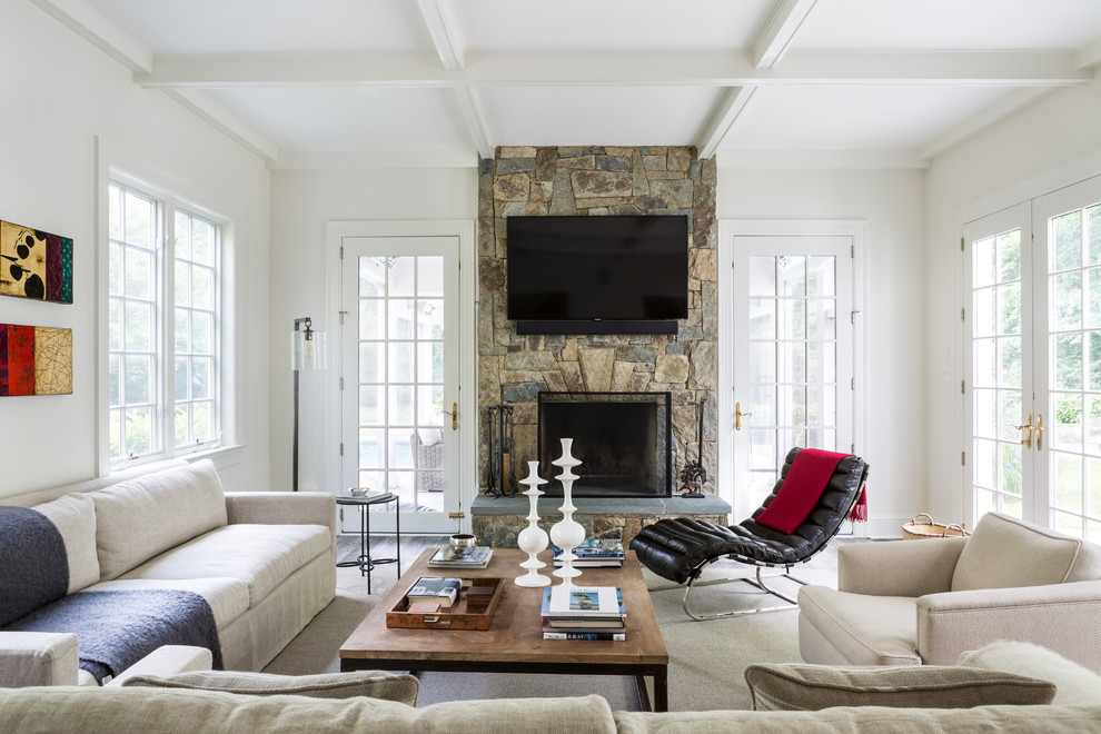 Design ideas for a country open concept family room in DC Metro with white walls, grey floor, a standard fireplace, a stone fireplace surround and a wall-mounted tv.