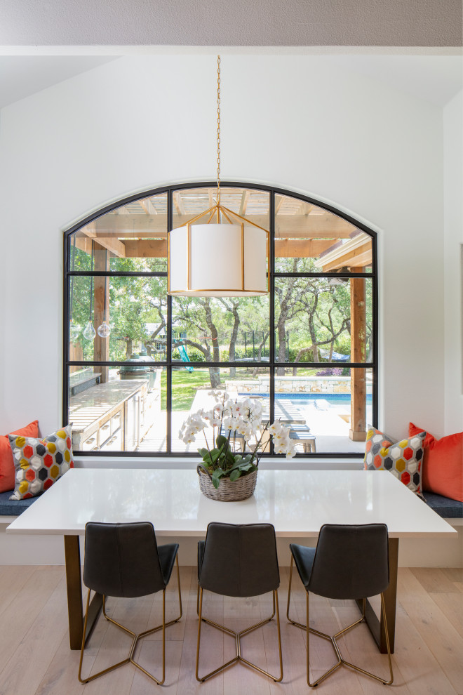 Inspiration for a large transitional light wood floor and beige floor kitchen/dining room combo remodel in Austin with white walls and no fireplace