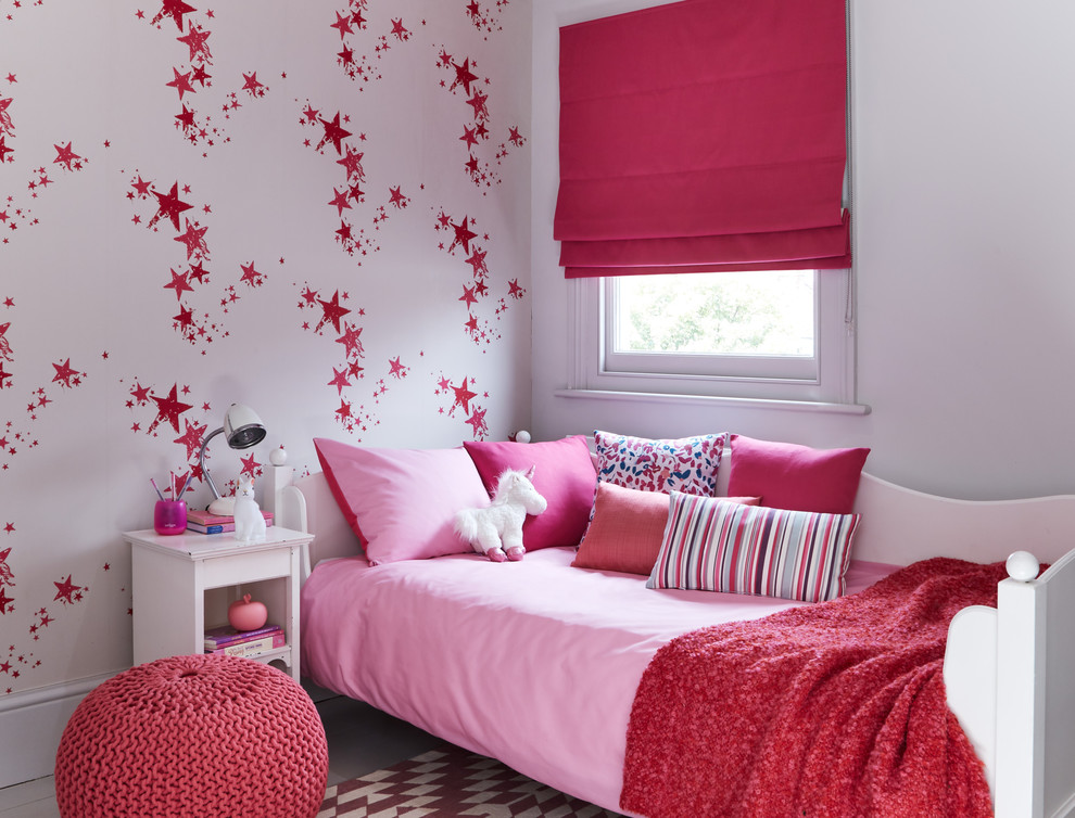 Photo of a transitional kids' bedroom for kids 4-10 years old and girls in Other with multi-coloured walls.