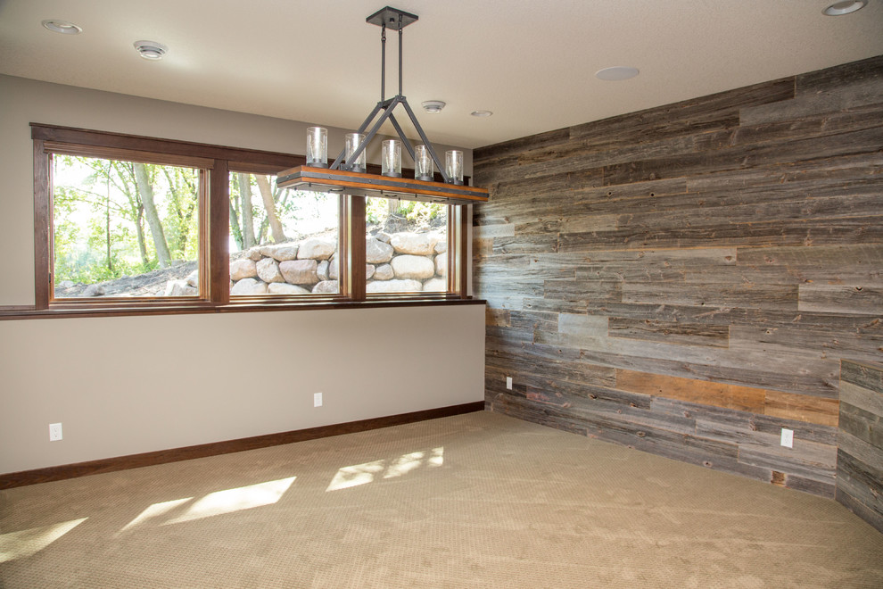 Example of a transitional look-out carpeted basement design in Minneapolis with gray walls