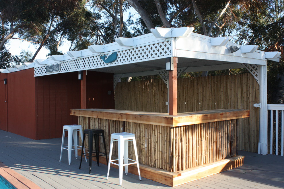 This is an example of a small beach style backyard patio in San Diego with a gazebo/cabana.