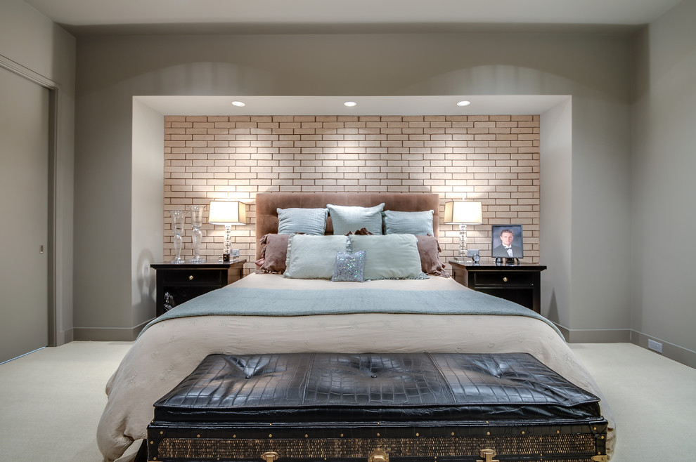 This is an example of a large modern master bedroom in Dallas with beige walls and carpet.
