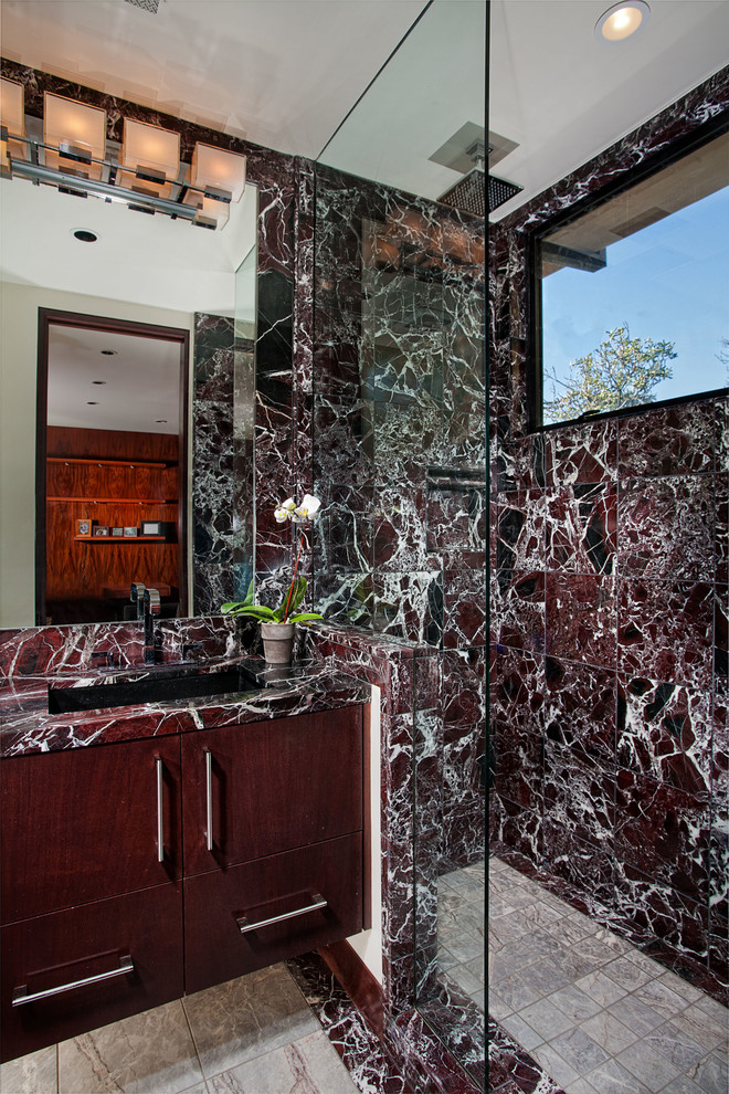 Design ideas for a contemporary bathroom in Orange County with flat-panel cabinets, dark wood cabinets, marble benchtops, red tile and marble.