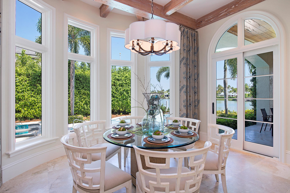 Inspiration for a mediterranean dining room in Miami with beige walls.
