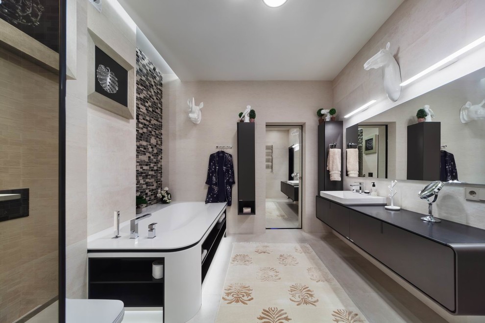 This is an example of a large contemporary 3/4 bathroom in Moscow with flat-panel cabinets, brown cabinets, an alcove tub, a curbless shower, a wall-mount toilet, beige tile, porcelain tile, beige walls, porcelain floors, an undermount sink, solid surface benchtops, beige floor, an open shower and white benchtops.