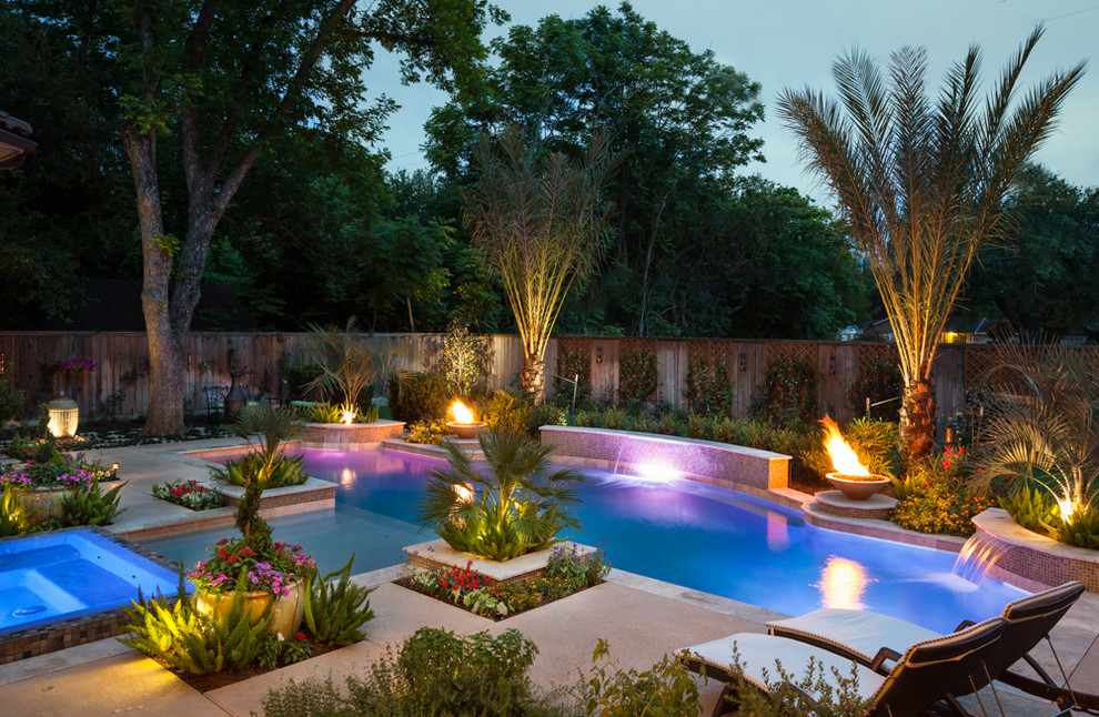 Inspiration for a traditional pool in Houston with stamped concrete and a hot tub.