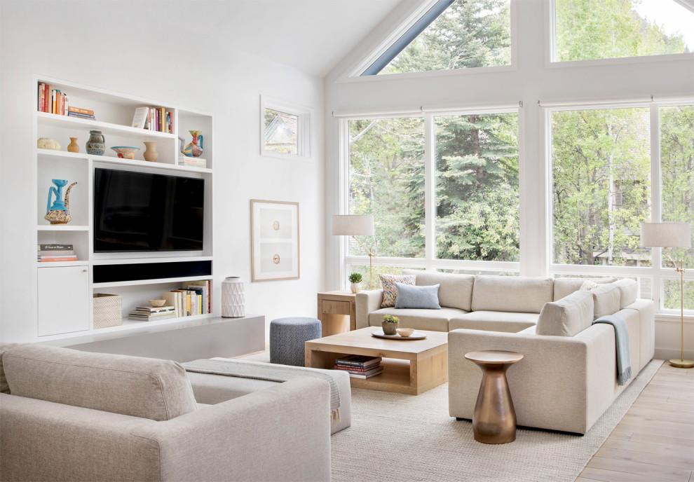 Mid-sized contemporary formal enclosed living room in Denver with white walls, carpet, a standard fireplace, a metal fireplace surround and a wall-mounted tv.