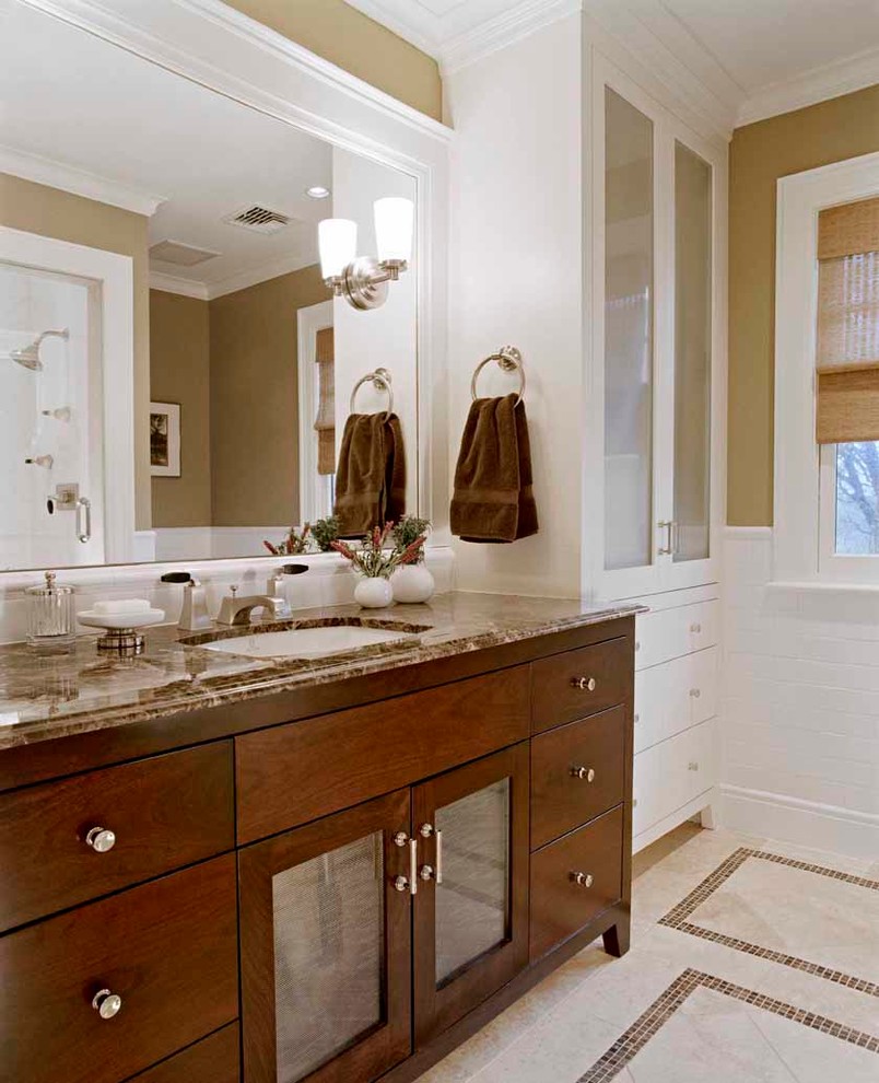 Mid-sized traditional master bathroom in Boston with an undermount sink, glass-front cabinets, white cabinets, marble benchtops, white tile, porcelain tile, beige walls and mosaic tile floors.