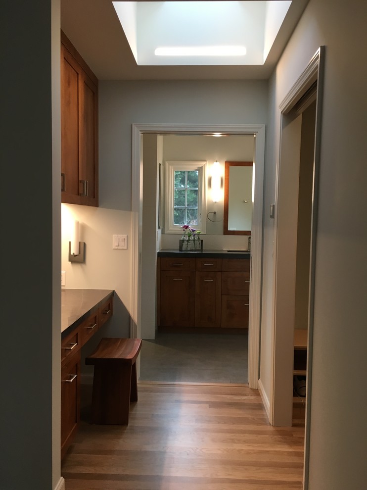 Photo of a mid-sized transitional master bedroom in San Francisco with grey walls and light hardwood floors.
