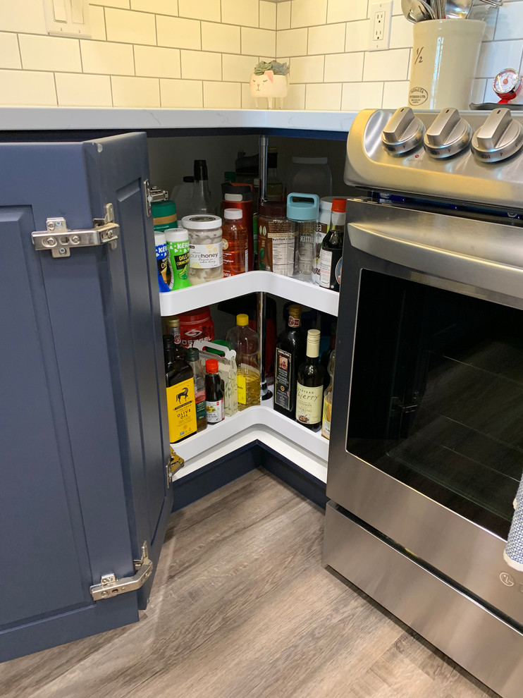 Example of a transitional kitchen design in Calgary