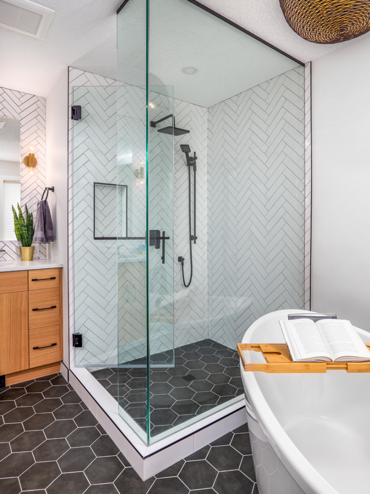 Inspiration for a large midcentury master bathroom in Calgary with white tile, quartzite benchtops, a hinged shower door, white benchtops, a freestanding tub, a corner shower, ceramic tile, white walls, porcelain floors and black floor.