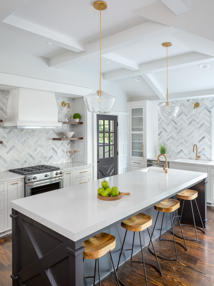 Large transitional u-shaped eat-in kitchen in Raleigh with an undermount sink, shaker cabinets, white cabinets, quartzite benchtops, grey splashback, marble splashback, stainless steel appliances, dark hardwood floors, with island, brown floor and white benchtop.